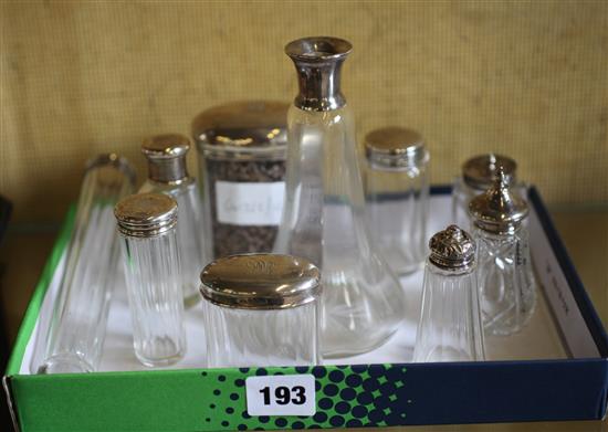 Collection of 9 silver & plated topped glass bottles & condiments